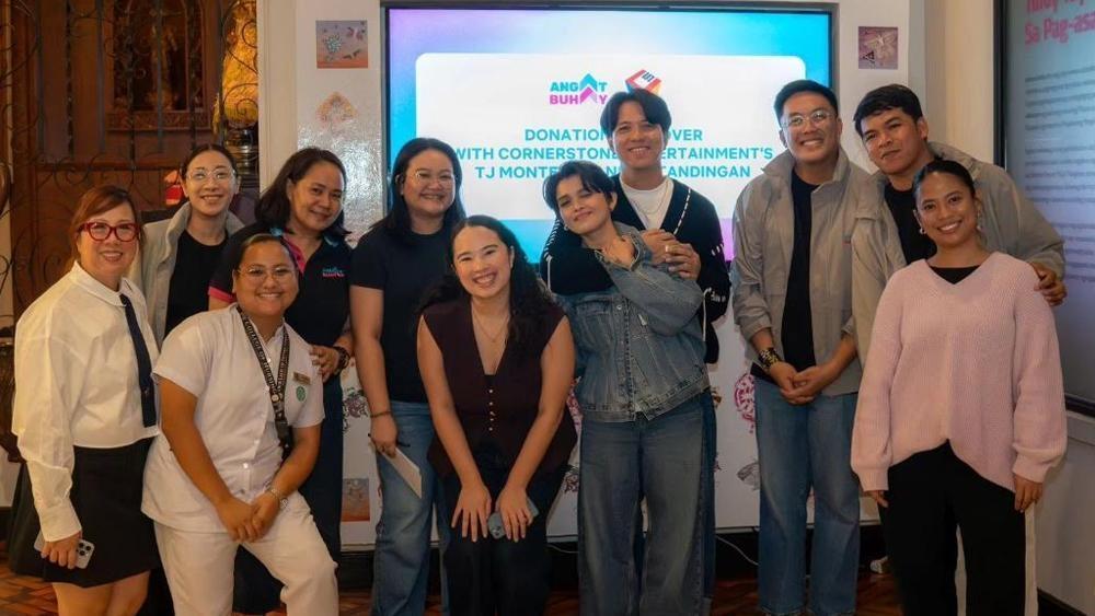 KZ Tandingan and TJ Monterde with Angat Buhay members