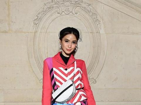 Heart Evangelista poses for photographers upon arrival at the Dior