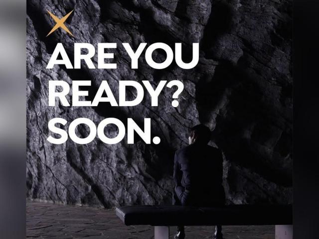 man sitting with a view of his back