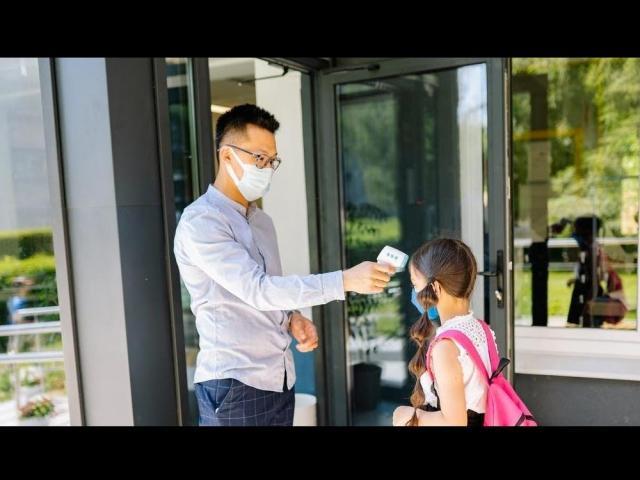 teacher and student with face masks