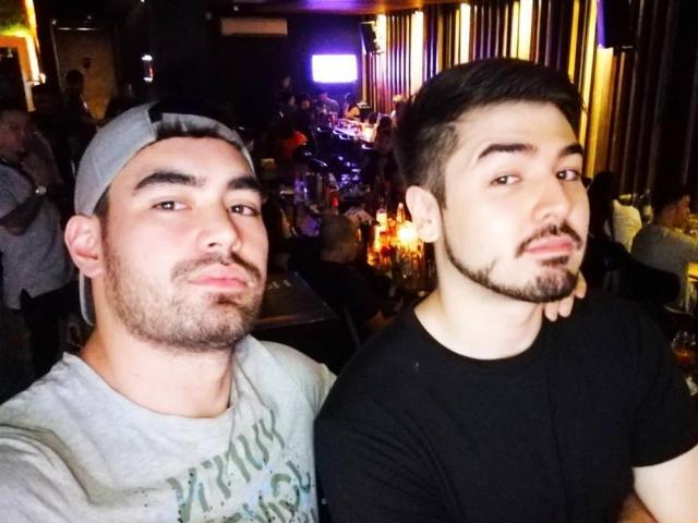 Longtime friends Clint Bondad and Andre Paras hanging out in a bar