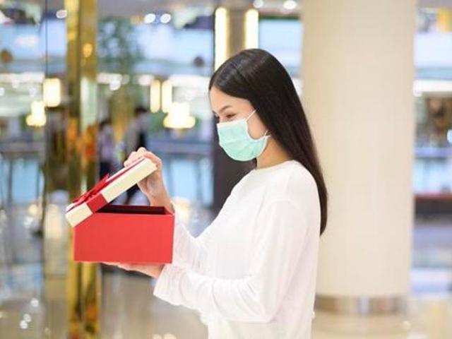 Woman holding a gift box