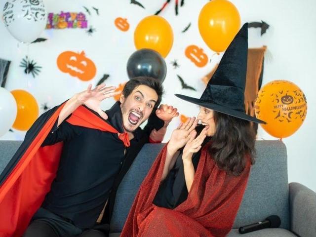 man and woman in halloween costumes