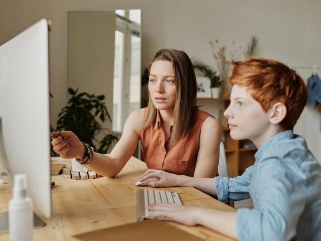 mother and child during online class
