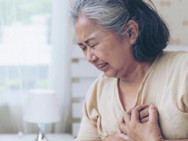 Old woman holding the heart