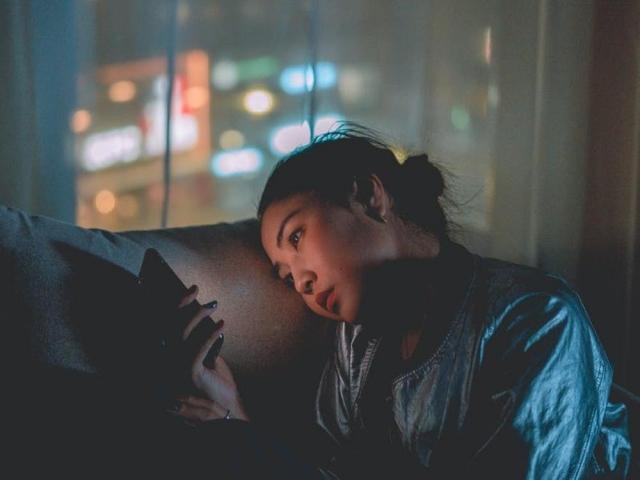 woman using smartphone at night