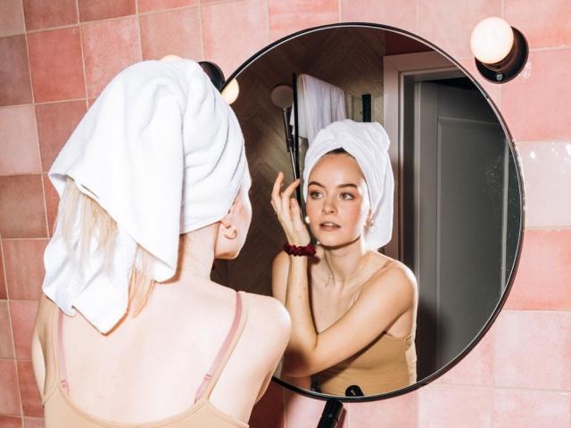 Woman looking at the mirror