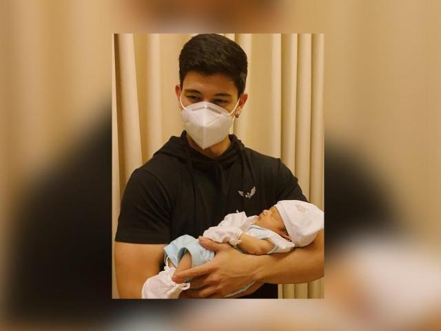 Ravyer Cruz holding Baby Joaquin