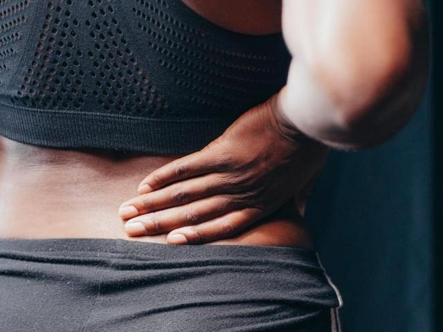 person touching kidney