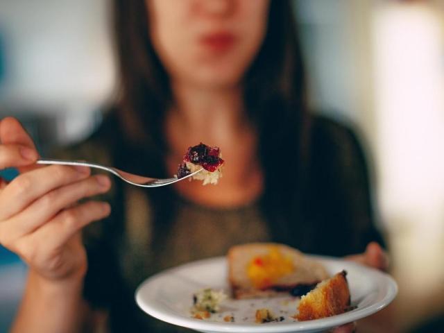 Woman holding a plate of food