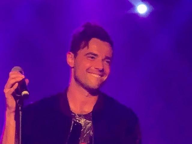 A1 member Ben Adams singing at a carinderia with a Filipina