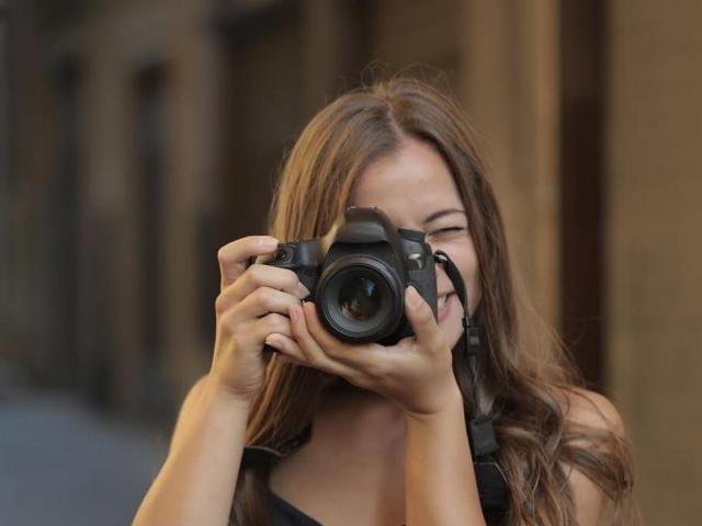 woman taking photos