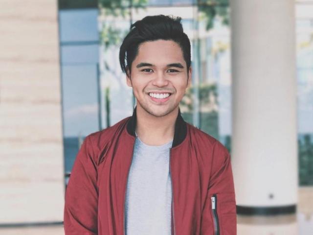 Miko Manguba on red jacket