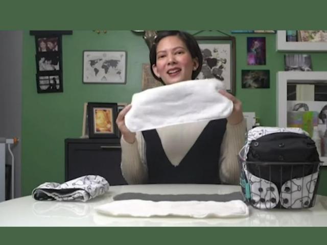 chynna ortaleza holding a cloth diaper