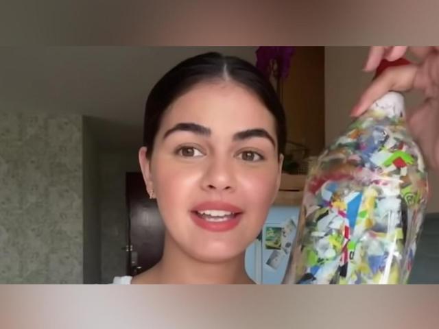 janine gutierrez holding an ecobrick