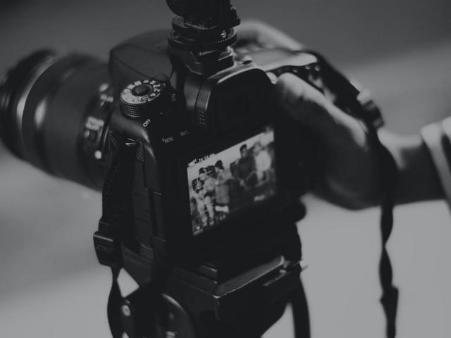 silhouette of man using a camera