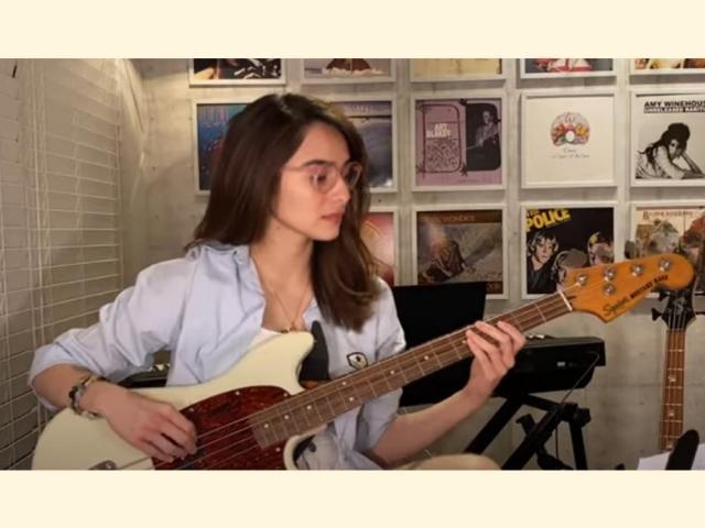 Jennylyn Mercado playing bass guitar