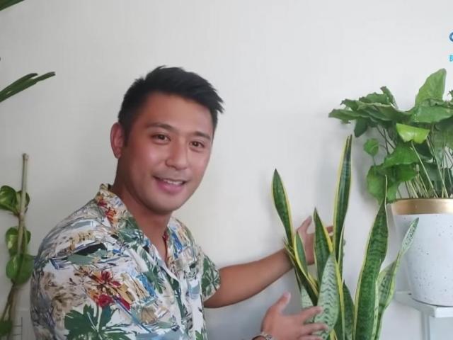 Rocco Nacino holding plant