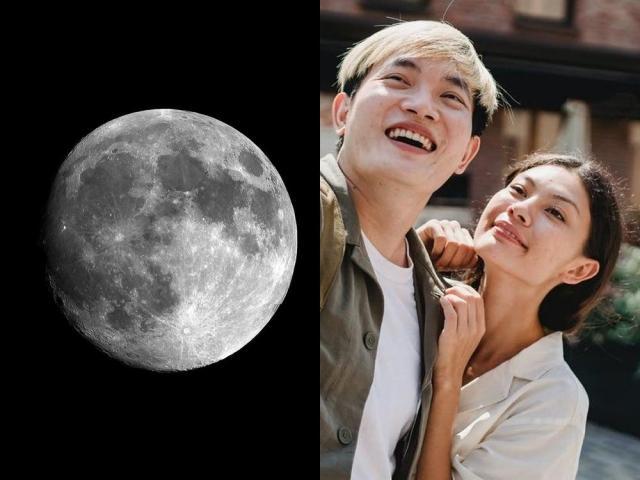 moon and a couple taking photos