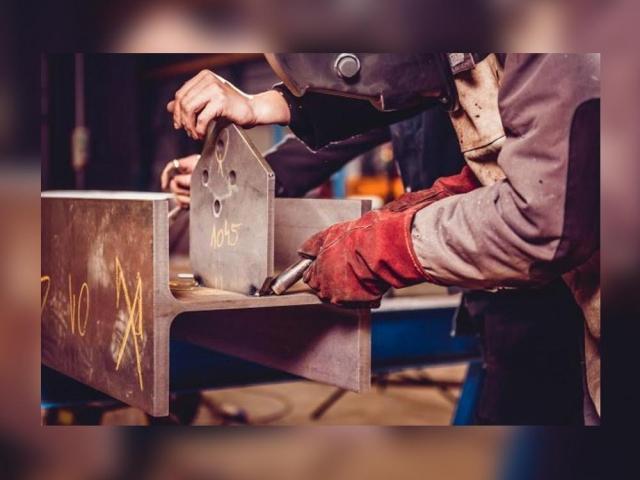 Industrial welder with a torch