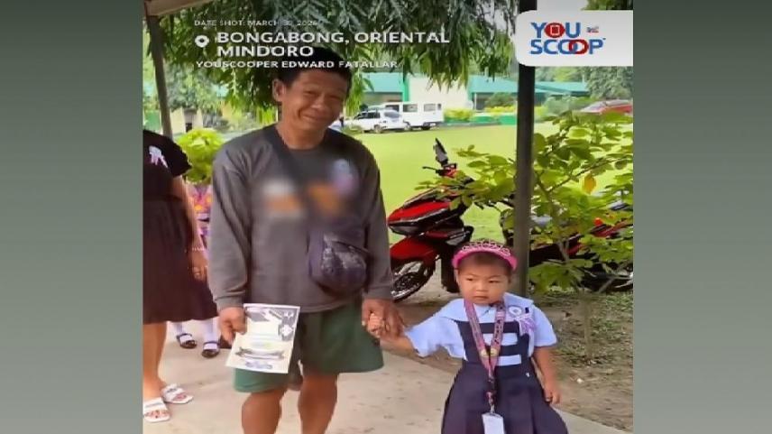 barefoot father in daughter's graduation