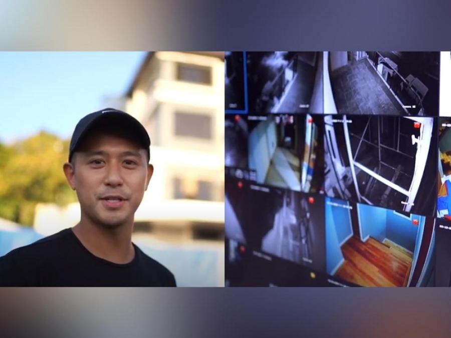 Rocco Nacino installing CCTV cameras