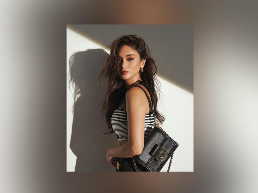 Pia Wurtzbach highlights a designer bag in her nautical-themed shoot