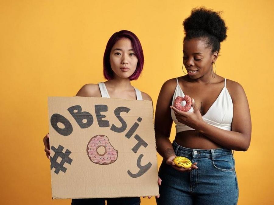 women with obesity placard