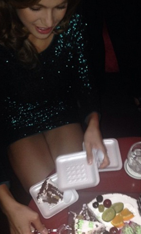 Andrea slices birthday cake