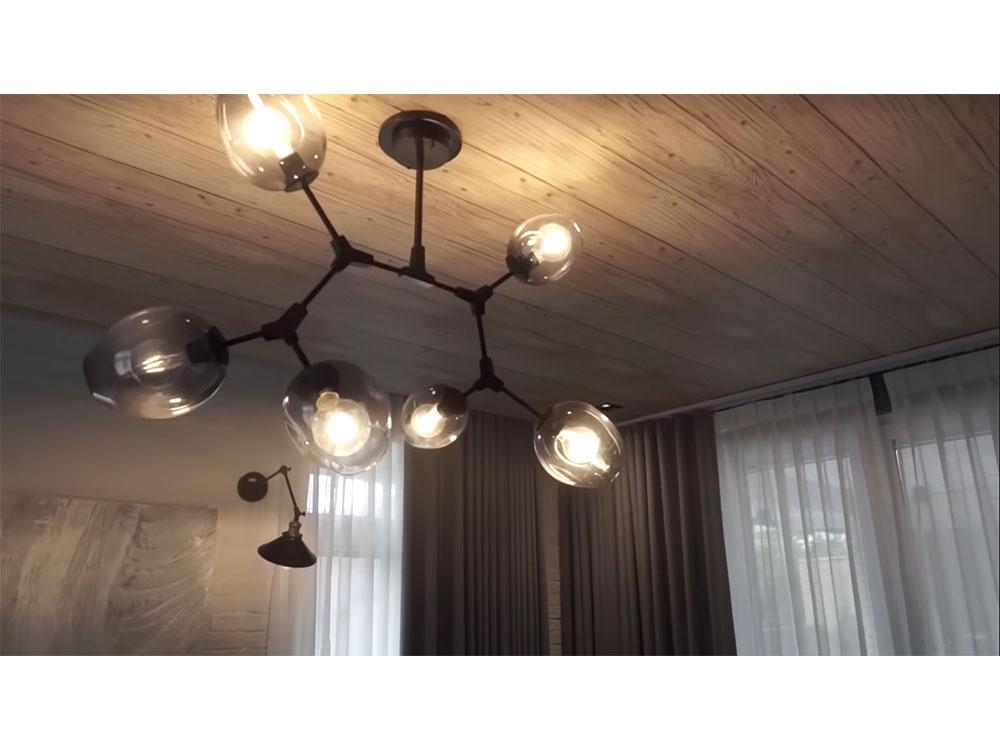 Chandelier and wood ceiling
