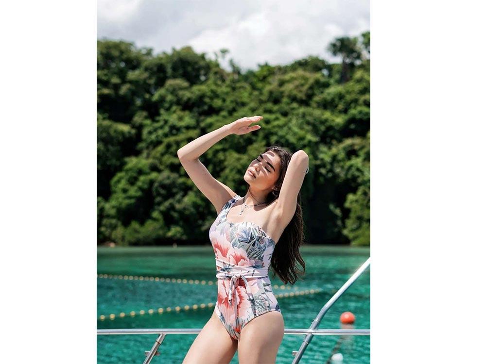 Teen Girl In Swimsuit And Shorts Poses Standing Near Swimming Pool Stock  Photo - Download Image Now - iStock