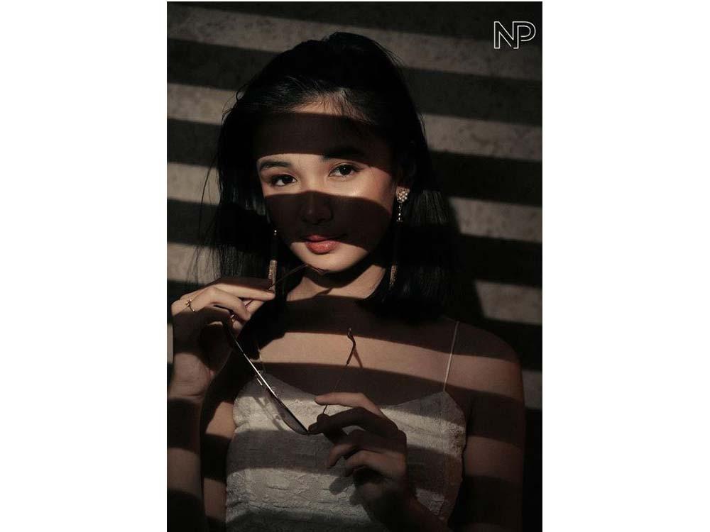 Holding her sunglasses