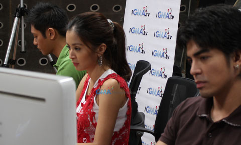 Kris looks onto the computer