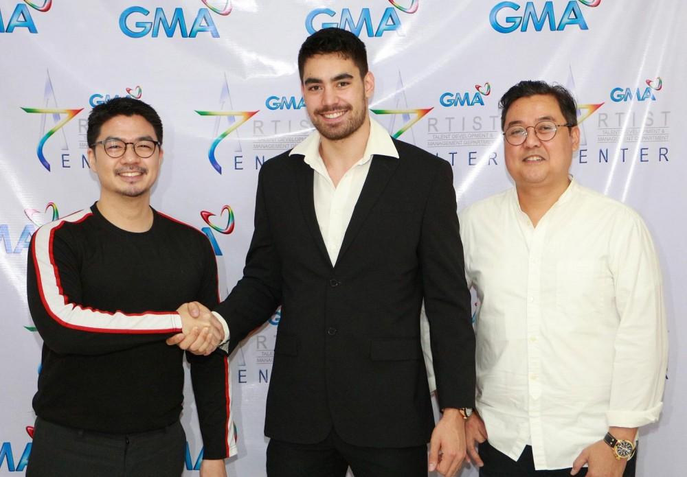 (L-R) GMA Artist Center Assistant Vice President and Head for Talent Imaging and Marketing Unit Simoun S. Ferrer, Clint Bondad, and Clint's co-manager John Brilliantes.