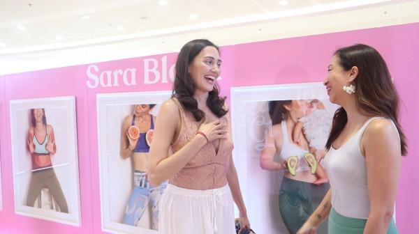 Sara Black chatting with an acquaintance during the pH Care Speak Up, Girl event