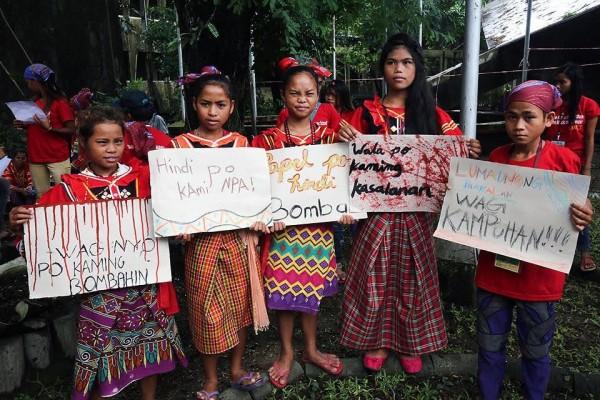 Lumad children calling on President Rodrigo Duterte to stop soldiers from encamping in their schools