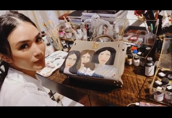Heart paints her bag