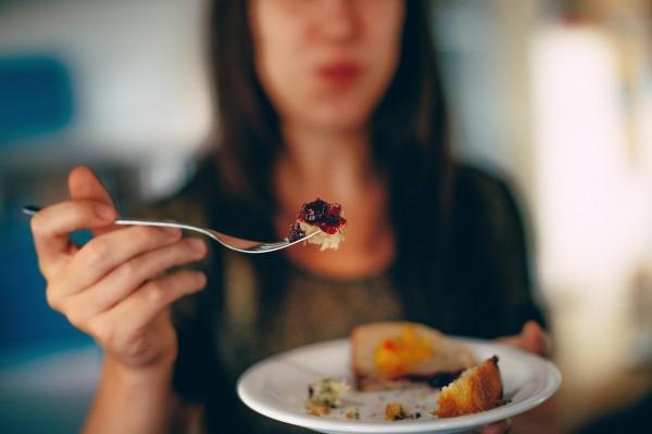 Woman holding a plate of food