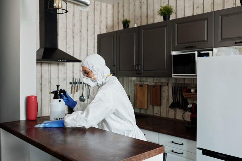 woman cleaning kitchen