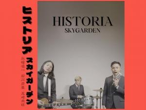 HISTORIA cover art, SKYGARDEN wearing coat and tie and in a band setup