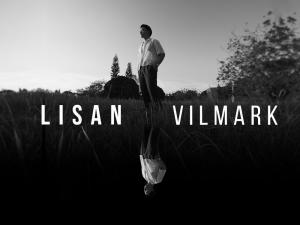 Lisan cover art; black and white photo of Vilmark in a grassy field