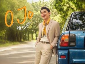 O Jo cover art; Vilmark very happy standing beside a car